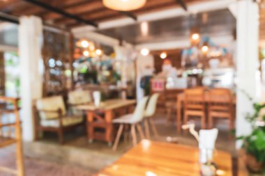 Bulanık kahve ve müşterilerin arka plan vintage ton renk tarzına sahip dinlendirici kafe.