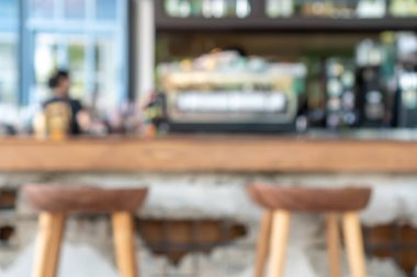 Bulanık kahve ve müşterilerin arka plan vintage ton renk tarzına sahip dinlendirici kafe.