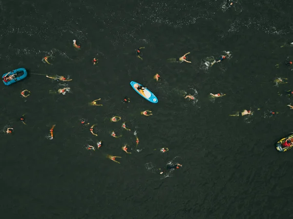 Triathlon swimming contest in lake swimmers competition aerial drone photo — Stock Photo, Image