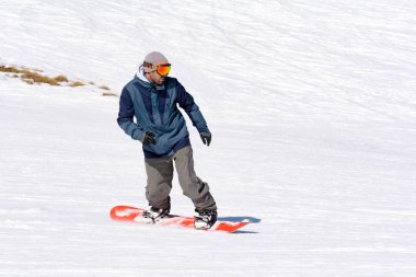 Snowborder in Mountain in Grandvalira, Canillo, Andorra clipart