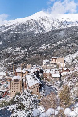 Beautiful landscape of Soldeu, Canillo, Andorra on an autumn morning in its first snowfall of the season. You can see almost completed the works of the track of the ski world cup of 2019. clipart
