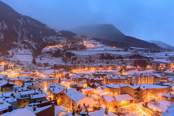 Snowy sunrise in the town of Canillo, Andorra. Cityscape  in Winter.