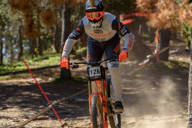 VALLNORD, ANDORRA  - JULY 4 2019:  CYCLIST in the MERCEDES-BENZ UCI MTB WORLD CUP 2018 - DHI Vallnord, Andorra on July 2019 clipart
