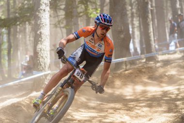 VALLNORD, ANDORRA  - JULY 7 2019:  CYCLISTS in the MERCEDES-BENZ UCI MTB WORLD CUP 2019 - XCO Vallnord, Andorra on July 2019 clipart