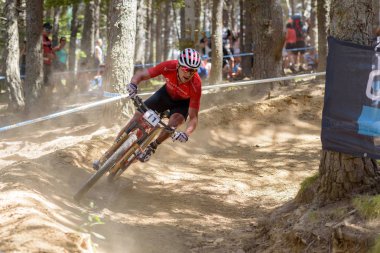 VALLNORD, ANDORRA  - JULY 7 2019:  CYCLISTS in the MERCEDES-BENZ UCI MTB WORLD CUP 2019 - XCO Vallnord, Andorra on July 2019 clipart