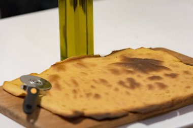 The faina (from faina, its name in the Genoese dialect of the language ligur, farinata or cecina in Italian) is a dish made from flour of chickpeas water olive oil salt and pepper. clipart