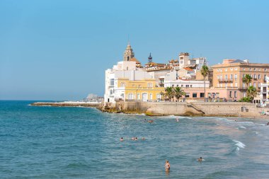 Sitges, Catalonia, Spain: July 28, 2020: People in the beach in Sitges in summer 2020. clipart