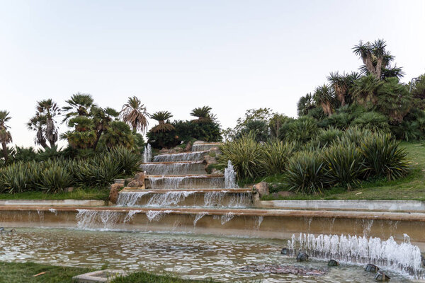 BARCELONA, SPAIN - september 26, 2020: It is a cascade fountain in the Jardins del Mirador Park on Mount Montjuic.