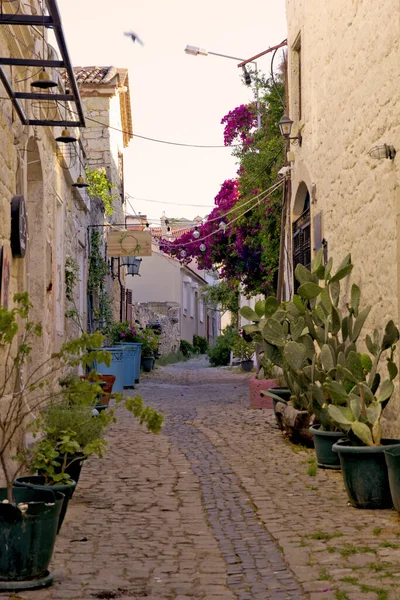 colorful and stone houses in narrow street in Alacati cesme, izmir