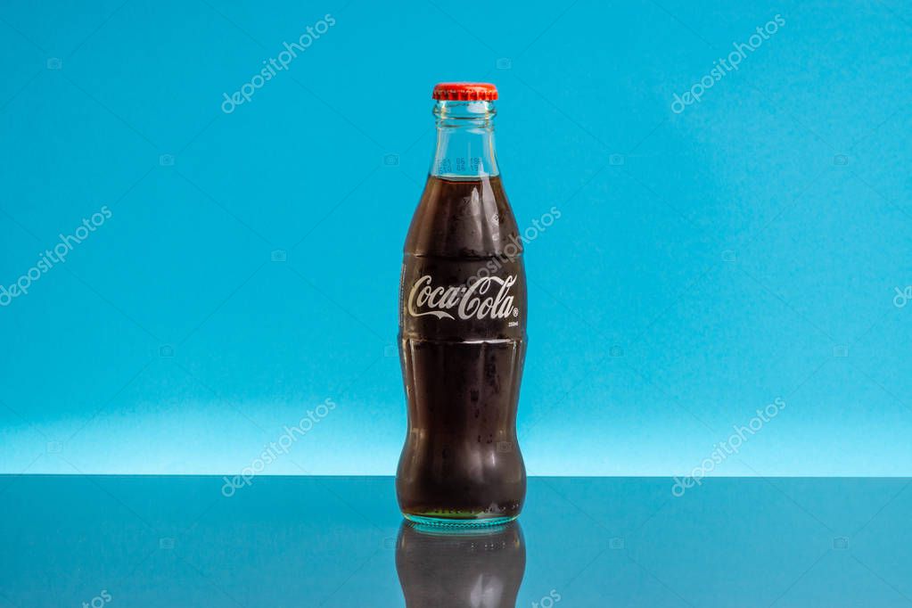 Kuala Lumpur, Malaysia - February 18,2019: Coca Cola drink on blue background. Selective focus and crop fragment