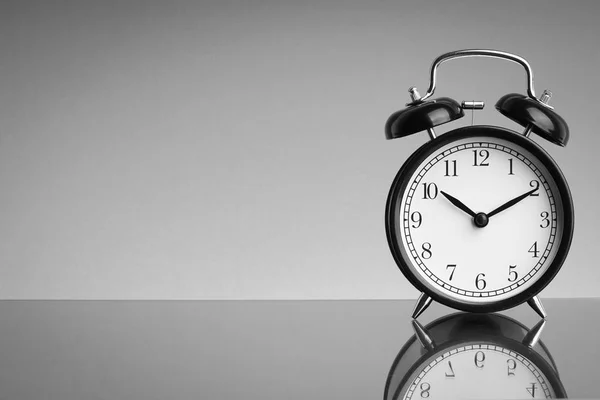 Alarm Clock on black and white background with selective focus and crop fragment. Business and Copy space concept