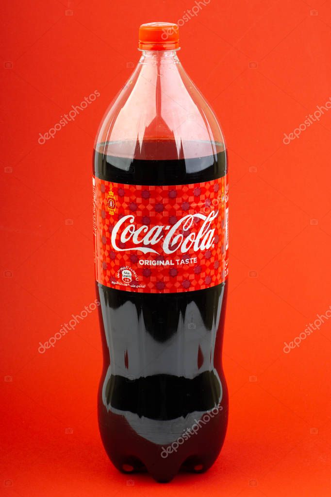 Kuala Lumpur, Malaysia - March 18,2019: Coca Cola Lantern edition bottle drink over a red  background with selective focus and crop fragment.