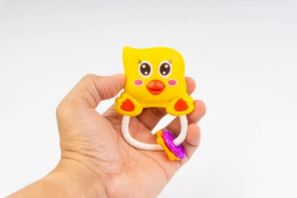 Hands Hold Rattle Toy Baby Toy White Background Selective Focus — Stock Photo, Image
