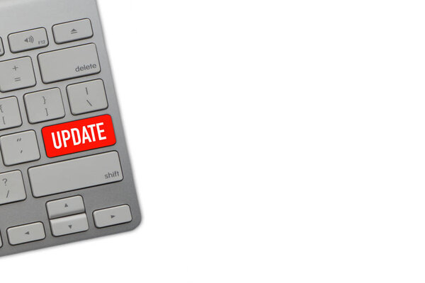 UPDATE текст с клавиатурой компьютера на белом фоне. Селективный фокус