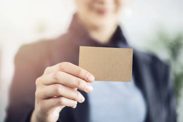 Business woman showing business card