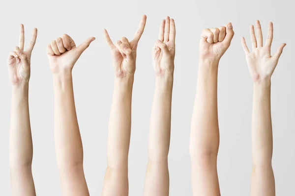 Кілька Жестів Жіночої Руки Сірому Фоні — стокове фото