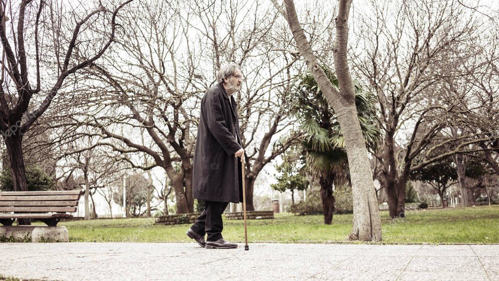 Old man walking in the park