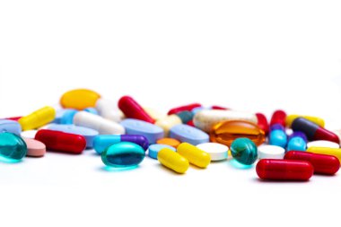 Pills and capsules close up view clipart