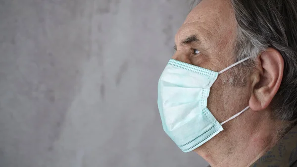 Old man wearing medical mask