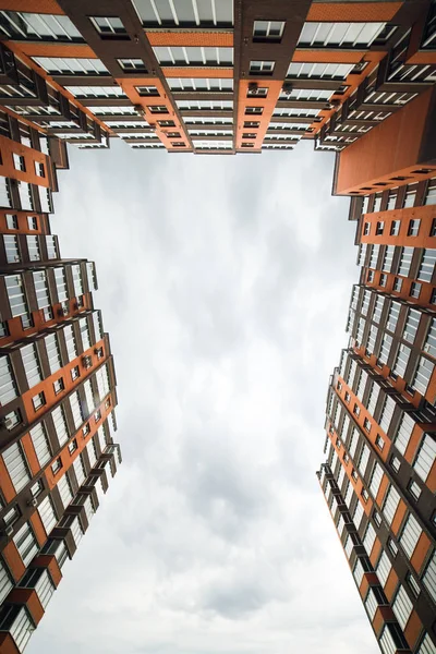 View of modern buildings below. Yard sleeping area.