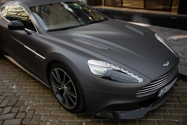 SOFIA BULGARIA August 12, 2019 : Photoshoot of black matte Aston Martin on street. Aston Martin Vantage is series of luxury hand built sports cars from the British manufacturer Aston Martin. — Stock Photo, Image