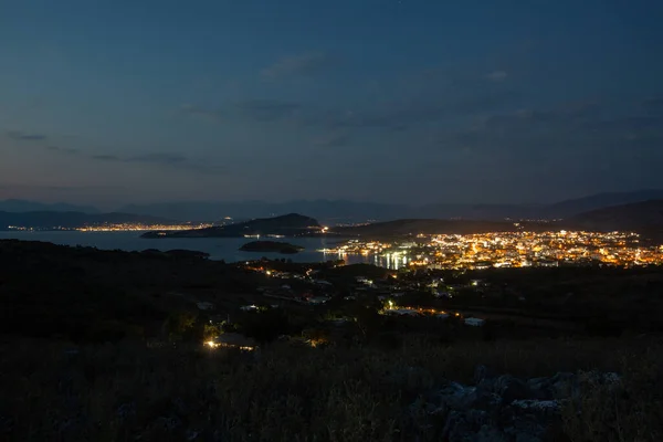 Aerial view of night town from Hill after sunset - modern city with spectacular nightscape panorama. aerial view, night city with night sky. natural summer night.