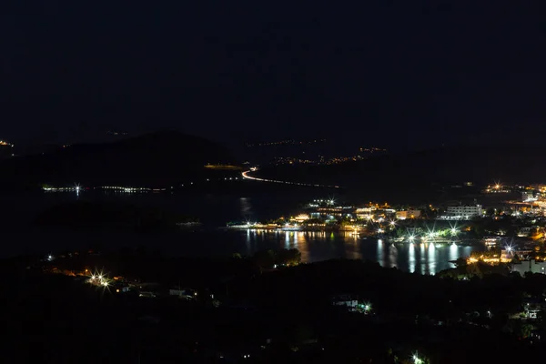 Aerial view of night town from Hill after sunset - modern city with spectacular nightscape panorama. aerial view, night city with night sky. natural summer night.