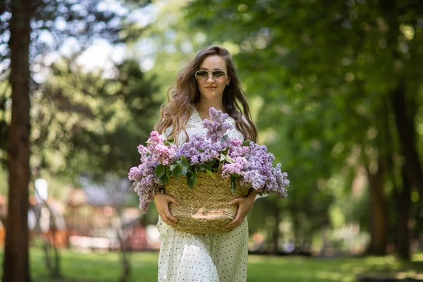Girl White Dress Holds Her Hands Wicker Basket Flowers Basket — Stock Photo, Image