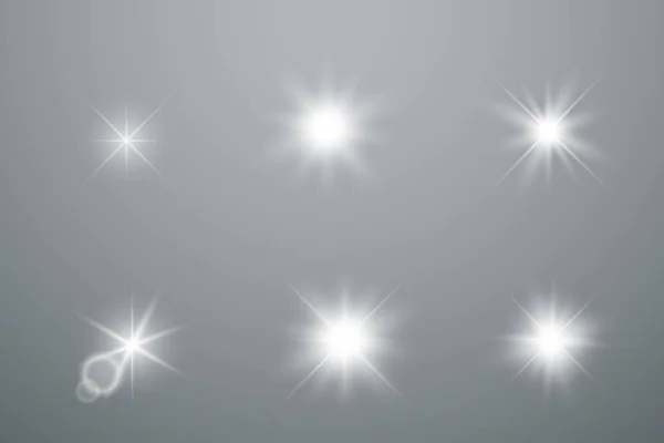Uppsättning av glödande ljus stjärnor — Stock vektor