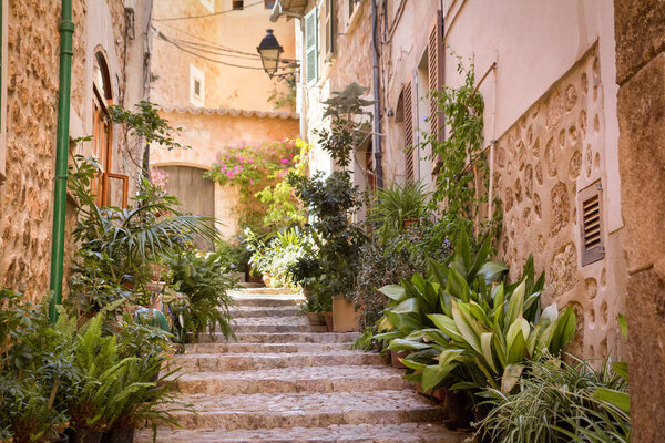 Steep stairs street in mediterranean medieval town. traditional Mallorca cobblestone street
