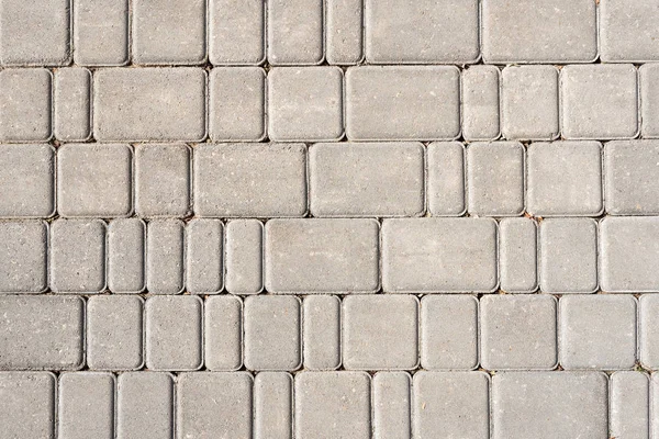 Taş döşeme arka plan. Gri düşkün dokulu. Farklı boyutlu kaldırım