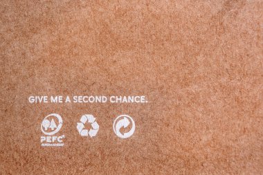 Kraft paper texture, a sheet of light beige craft paper as background. World resources concept. Reusing paper-based products. Ecological problems. Reusing concept. clipart