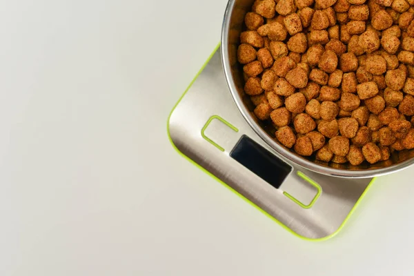 dry dog food on scales