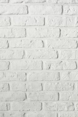 Beyaz Ortaçağ dekoratif tuğla duvar. kapatın. Dikey görünüm