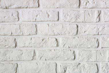 Beyaz Ortaçağ dekoratif tuğla duvar. kapatın. Yatay görünüm