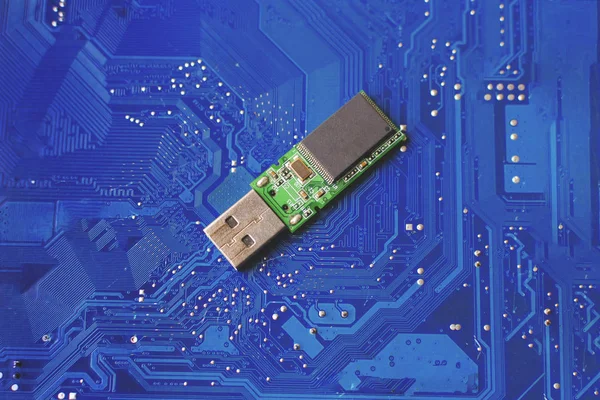 flash drive on a blue electronic board