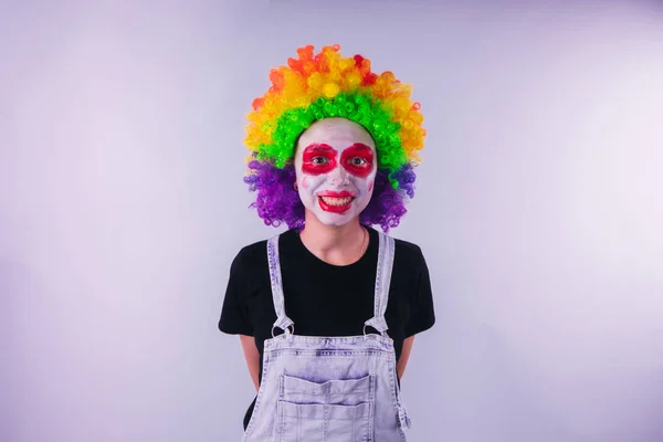 girl in a bright image of a clown. emotional portrait of a student. costumed presentation of children's animator. Female clown