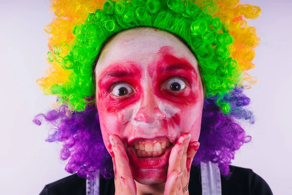 girl in a bright image of a clown. emotional portrait of a student. costumed presentation of children\'s animator. Female clown