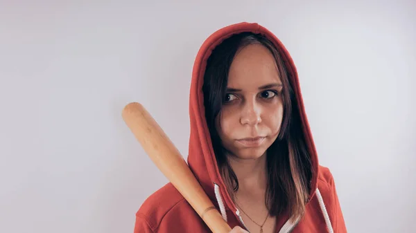 Young cute girl with baseball bat, Girl with a bat. girl or criminal woman, holding baseball bat in hand.  Sport and training