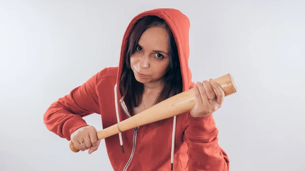 Young cute girl with baseball bat, Girl with a bat. girl or criminal woman, holding baseball bat in hand.  Sport and training