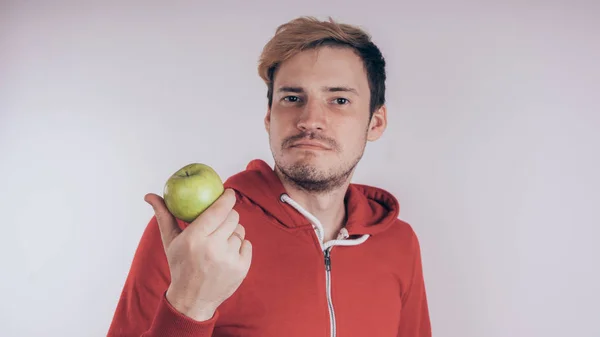 Guy Cheerful Face Holds Green Apple Red Heart Shaped Balloon — Stock Photo, Image