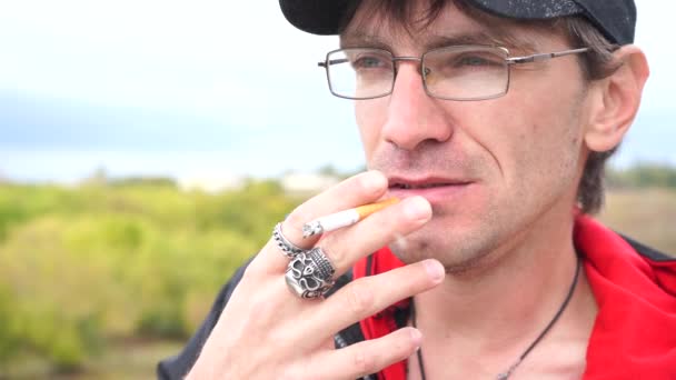 Man Smokes Cigarette Guy Glasses Smokes Cigarettes Tobacco Smoke — Stock Video