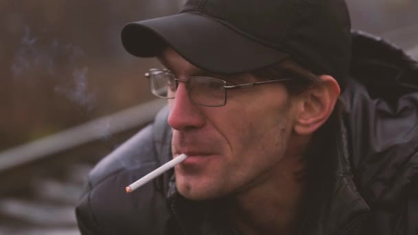 Man Smokes Cigarette Guy Glasses Smokes Cigarettes Tobacco Smoke — Stock Video