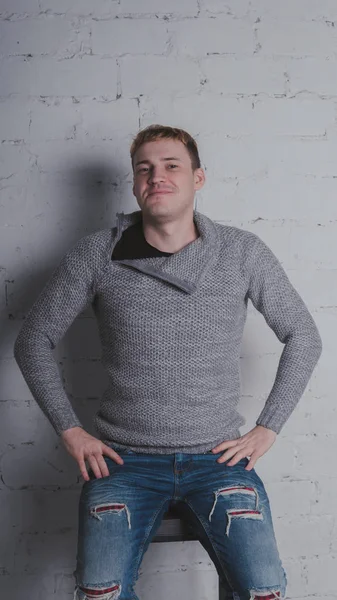 Guy Warm Sweater Chair Gray Background Man Posing Brick Wall — Stock Photo, Image