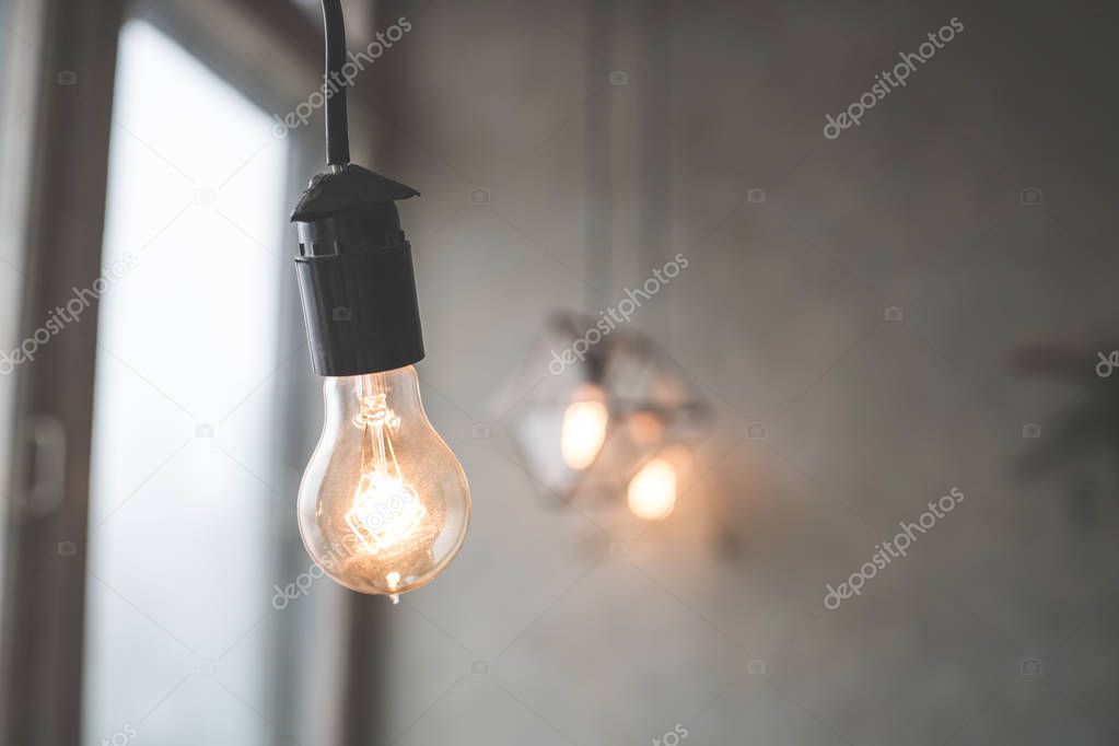 Lamps with tungsten filament. Edison light bulb. Filament filament in vintage lamps. Retro design of light bulbs. 