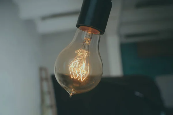 Lamps with tungsten filament. Edison light bulb. Filament filament in vintage lamps. Retro design of light bulbs.