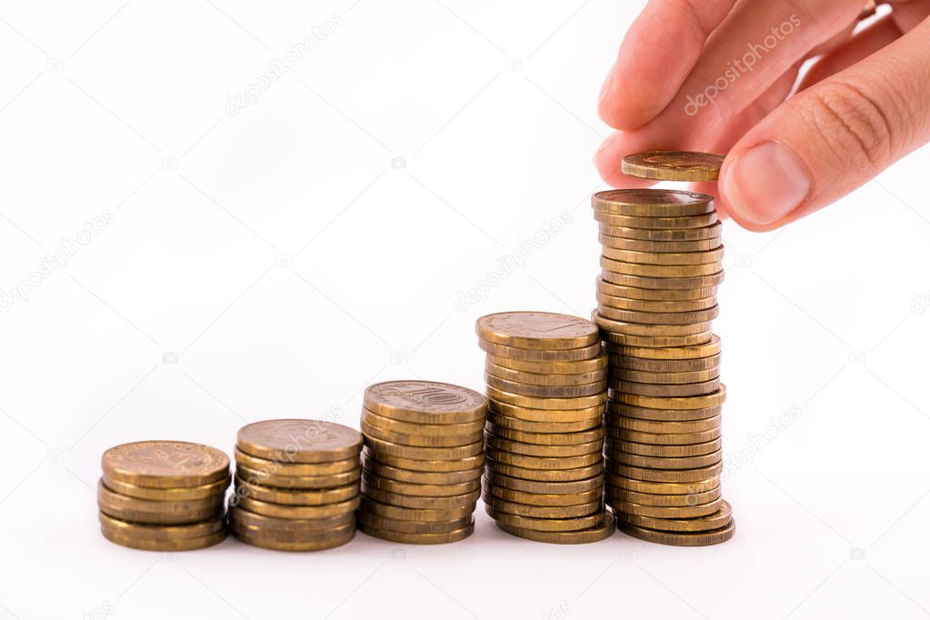 Stop motion rising stack of gold coins, rising money investment and increasing profits on a white isolated background.