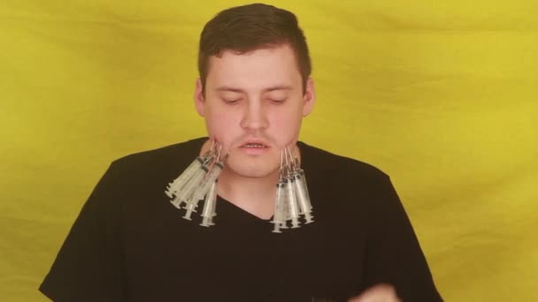 Man Syringes His Cheeks — Stock Video