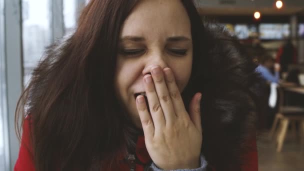 Woman Indoors Window Winter Day Yawning — Stock Video