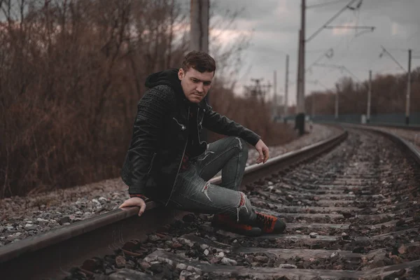 Trendy Young Man Sitting Rails — Stock Photo, Image